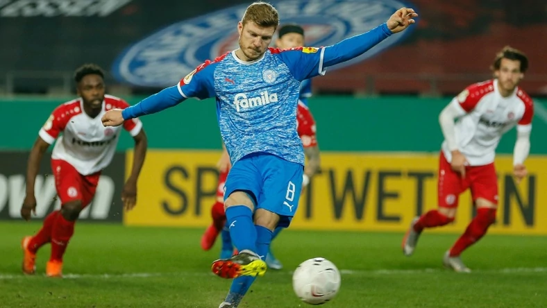 Holstein Kiel midfielder Alexander Muehling nets their first-half penalty at Kiel