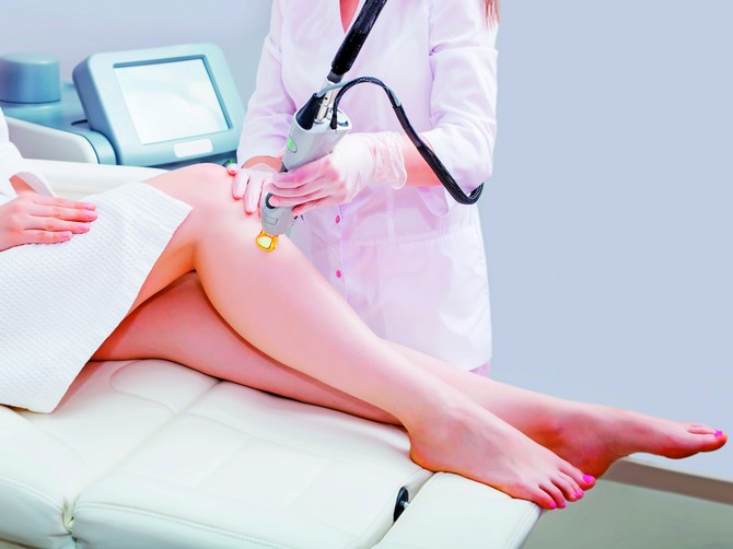 141296_stockphotolaserepilationandcosmetologyatcosmeticbeautyspaclinichairremovalcosmetologyprocedure519909325