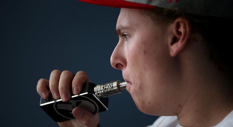 A man using an e-cigarette.