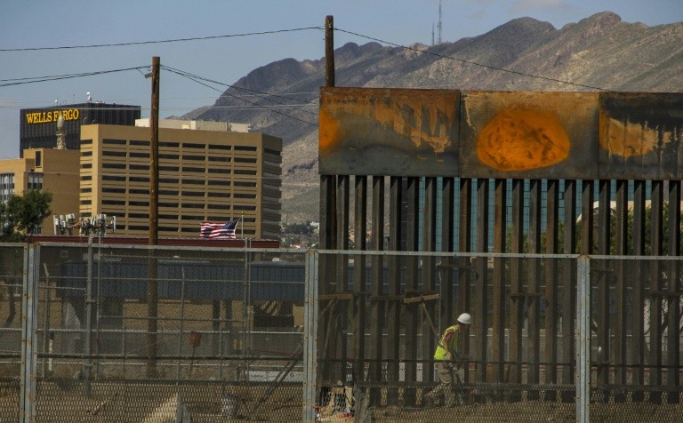 Workers in El Paso, Texas, replaced a section of the Mexico-US border fence in September 2018 next to the international "Paso del Norte" border bridge, as as seen from Ciudad Juarez, Mexico