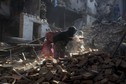 Local residents clear the rubble from their homes which were destroyed after last week's earthquake in Bhaktapur