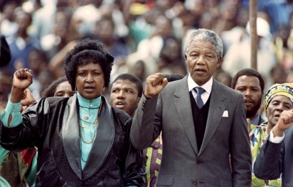 Winnie and Nelson Mandela raise their fists in protest 
