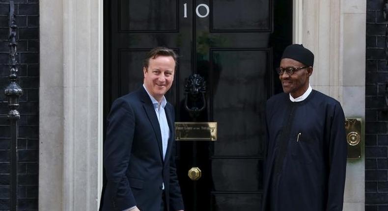 Nigeria's President-elect Muhammadu Buhari (R) departs after meeting with Britain's Prime Minister David Cameron at Downing Street in London, England, May 23, 2015. REUTERS/Neil Hall