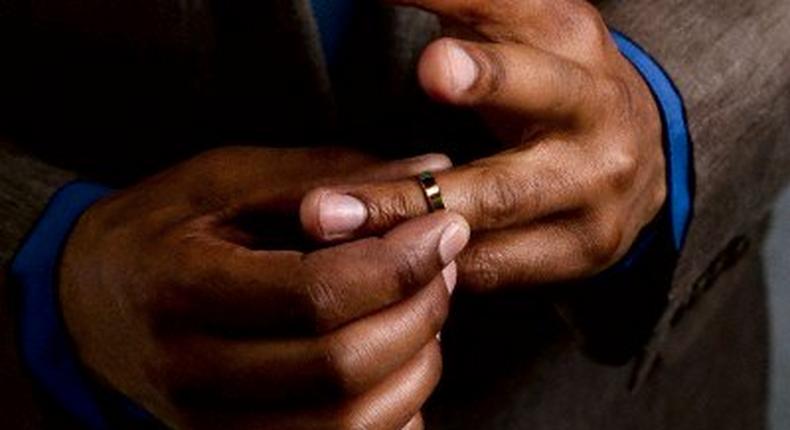 Man taking off wedding ring