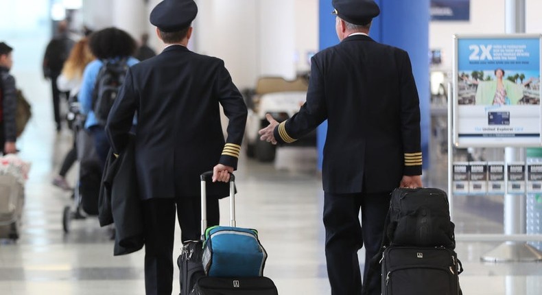 United Airlines pilots walk through Newark Liberty International Airport
