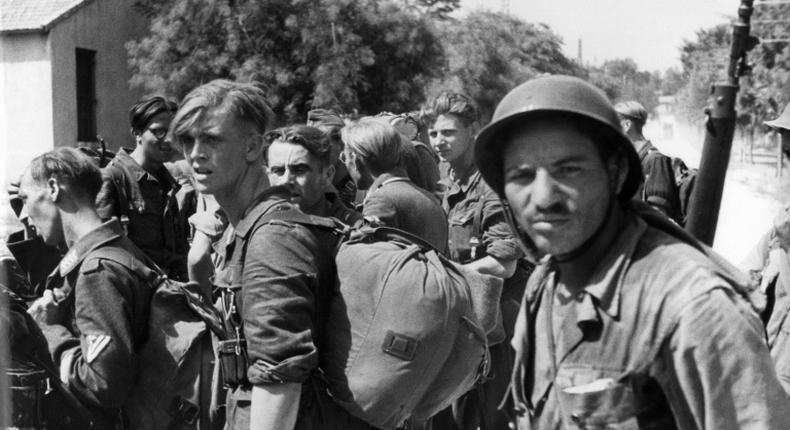 Algerian riflemen guarding German prisoners in Marseille, southern France, in August 1944