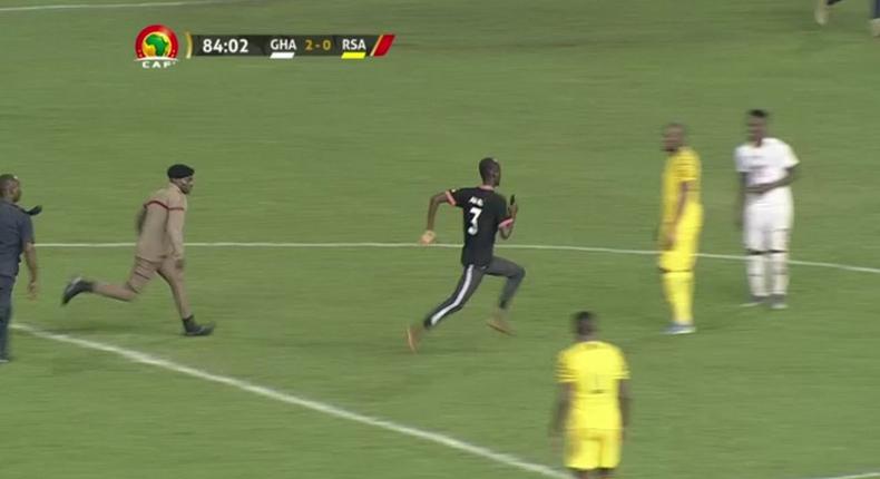 Pitch invader, Awal Suleman being chased 