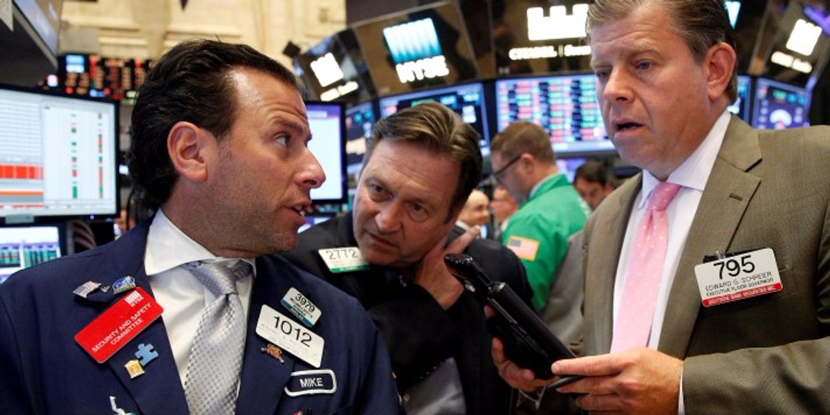 Traders work on the floor of the New York Stock Exchange (NYSE) in New York City