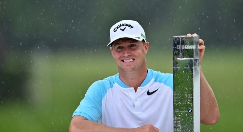 Sweden's Alex Noren poses with the trophy after winning the BMW PGA Championship, at Wentworth Golf Club in in Surrey, south-west of London, on May 28, 2017