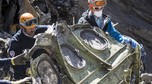 French gendarmes, seen in this picture made available to the press by the French Interior Ministry  work near debris from wreckage showing a German flag at the crash site of a Germanwings Airbus A320, near Seyne-les-Alpes