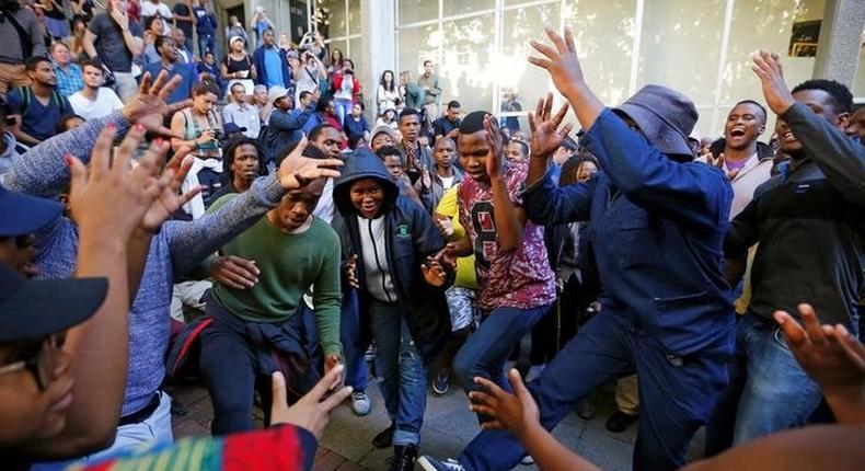 University of Cape Town (UCT) students sing during protests demanding free tertiary education in Cape Town, South Africa, October 3, 2016. 
