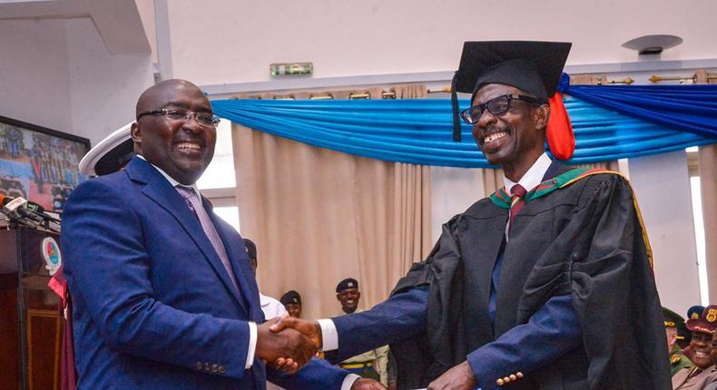 Dr Bawumia  with 'General Mosquito' as he grabs Master's degree