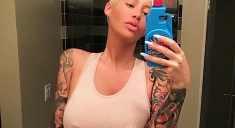 Amber Rose fluants nipple piercings on sicoal media