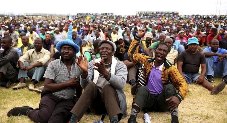 Miners gather at Wonderkop stadium outside the Lonmin mine in Rustenburg, northwest of Johannesburg in this January 30, 2014 file photo.  REUTERS/Siphiwe Sibeko/Files