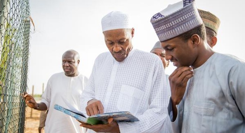 President Muhammadu Buhari and his son Yusuf, during a visit to the President's farm in Daura, Katsina State.