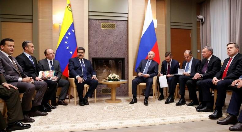 Russian President Vladimir Putin (5R) meets with his Venezuelan counterpart Nicolas Maduro (4L) at the Novo-Ogaryovo state residence outside Moscow on December 5, 2018