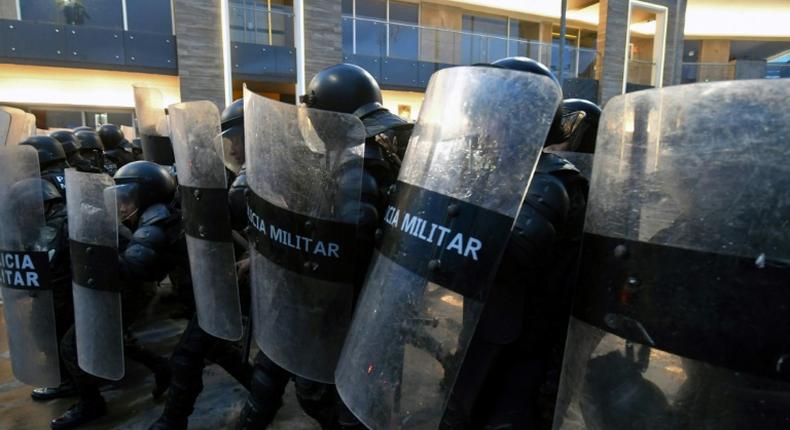 Police clash with protesters demanding the resignation of Honduran President Juan Orlando Hernandez