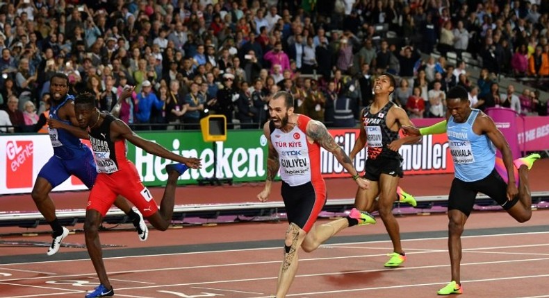 Turkey's Ramil Guliyev (C) wins the final of the men's 200m athletics event at the 2017 IAAF World Championships at the London Stadium in London on August 10, 2017