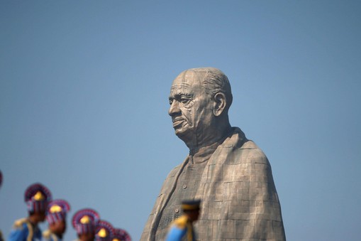 Police officers stand near the Statue of Unity portraying Sardar Vallabhbhai Patel, one of the fou