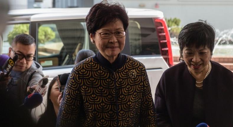 Hong Kong's former deputy leader Carrie Lam (C) arrives at the city's High Court to testify in the high-profile corruption trial of former Hong Kong chief executive Donald Tsang (not pictured) on January 26, 2017