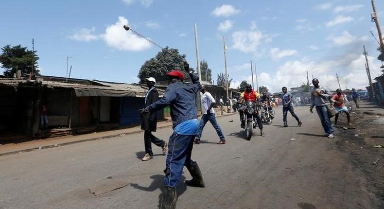 A supporter of Kenya's opposition Coalition for Reforms and Democracy (CORD) uses a sling to hurl stones towards their opponents during a protest against at the Independent Electoral and Boundaries Commission (IEBC) to demand the disbandment of the electoral body ahead of next year's election in Nairobi, Kenya, June 6, 2016. 