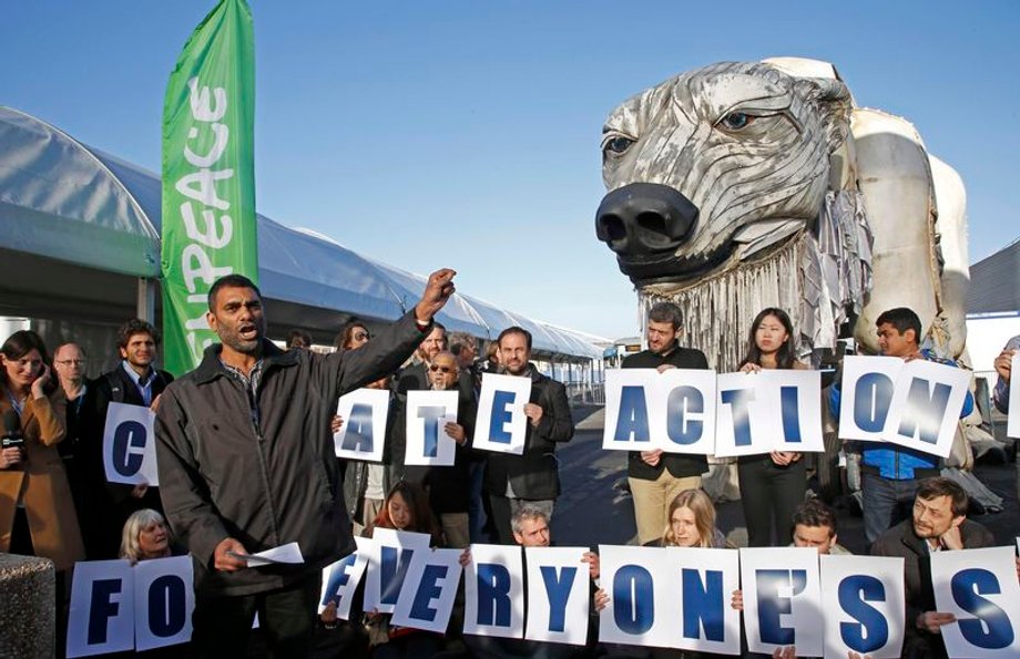 Greenpeace's International director Kumi Naidoo delivers a speech during a demonstration at the World Climate Change Conference 2015 (COP21) in Le Bourget