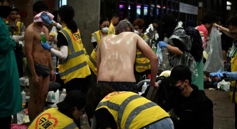 Anti-government protesters sprayed by pepper-water and teargas being treated by volunteer medics the Polytechnic University of Hong Kong