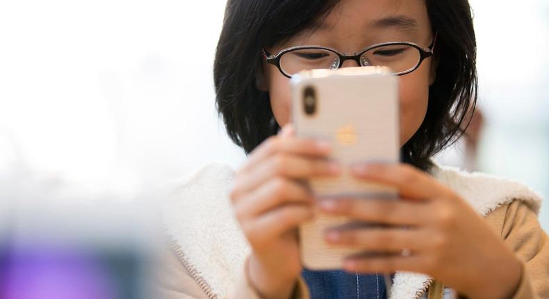 Child looking at phone