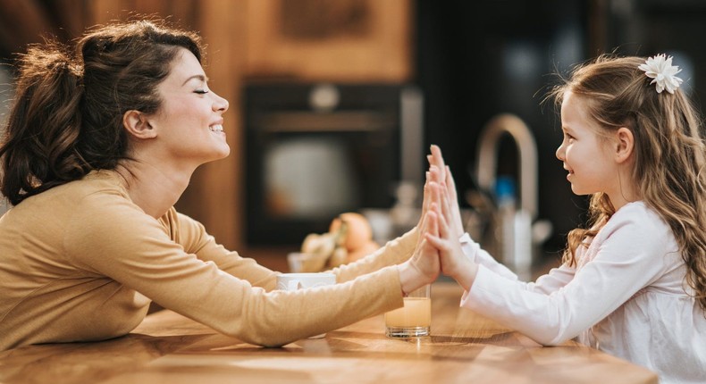 Authoritative parents work with kids as a team, offering emotional support and teaching positive behaviors.Skynesher / Getty Images