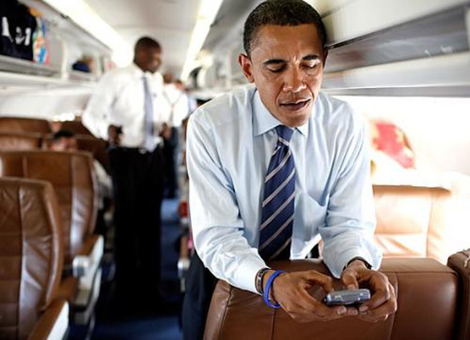 Former President Barack Obama, probably texting Michelle to make dinner plans.