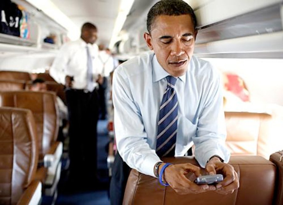 Former President Barack Obama, probably texting Michelle to make dinner plans.