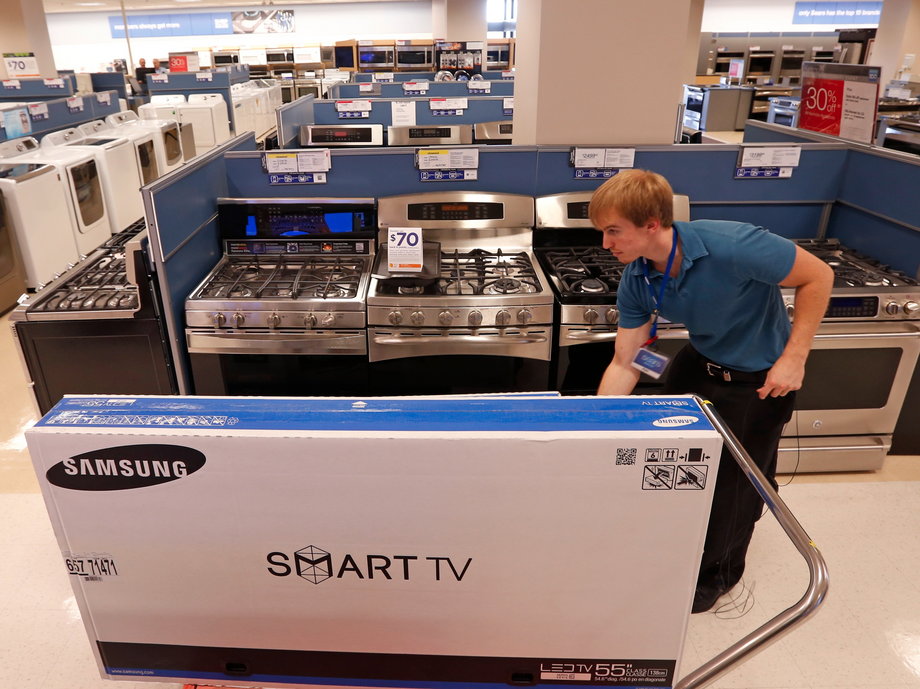 A worker unpacks televisions at a Sears store in Schaumburg, Illinois near Chicago.