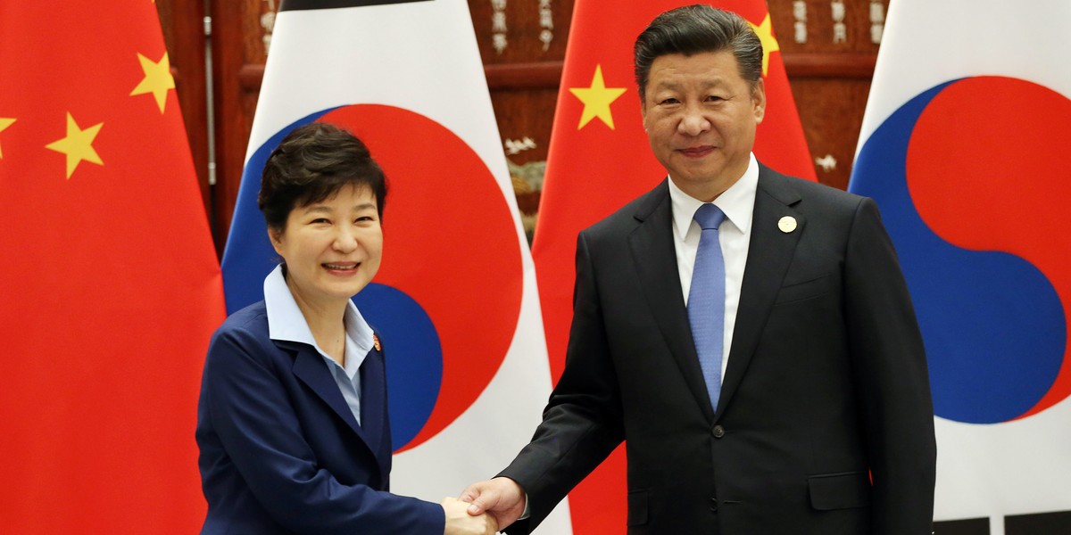 South Korean President Park Geun-hye shakes hands with Chinese President Xi Jinping at the G-20 Summit.