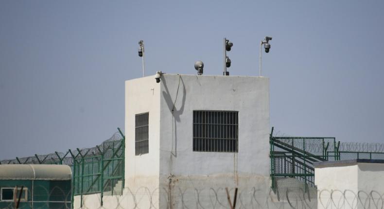 This May 2019 photo shows the outer wall of a complex in Hotan, in China's Xinjiang region, which includes what is believed to be a re-education camp where Muslim ethnic minorities are detained