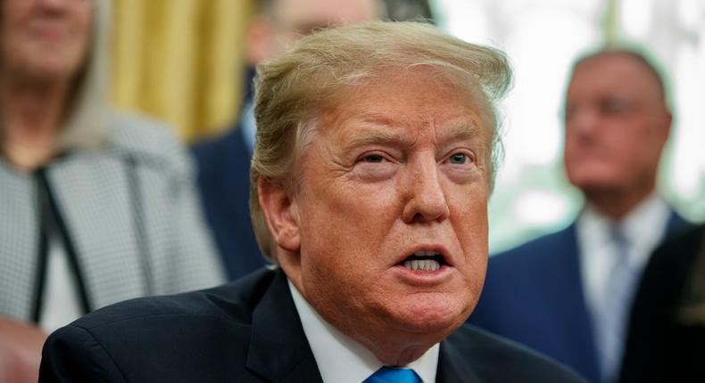 President Donald Trump speaks during a signing event for