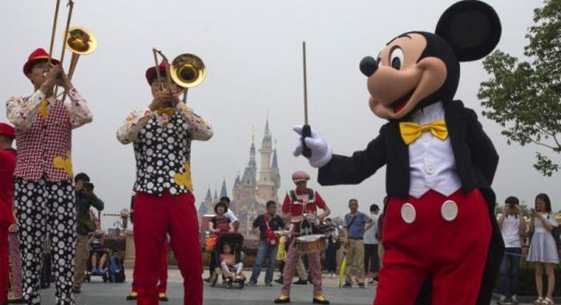 Mickey Mouse entertains visitors on the opening day of the Disney Resort in Shanghai, China.