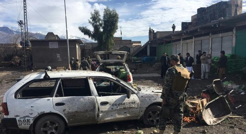 Pakistani security officals inspect the site of a bomb explosion at a vegetable market in Parachinar city, the capital of the northwestern Kurram tribal district on the Afghan border, on January 21, 2017 At least 20 people were killed and 40 wounded when a bomb exploded in a market on January 21 in a mainly Shiite area of Pakistan's northwestern tribal belt, officials said.