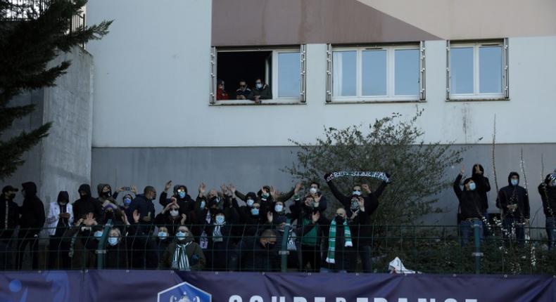 Seeing Red: Even though the match was played behind closed doors, Red Star fans found ways to cheer their tea to a cup victory over Lens