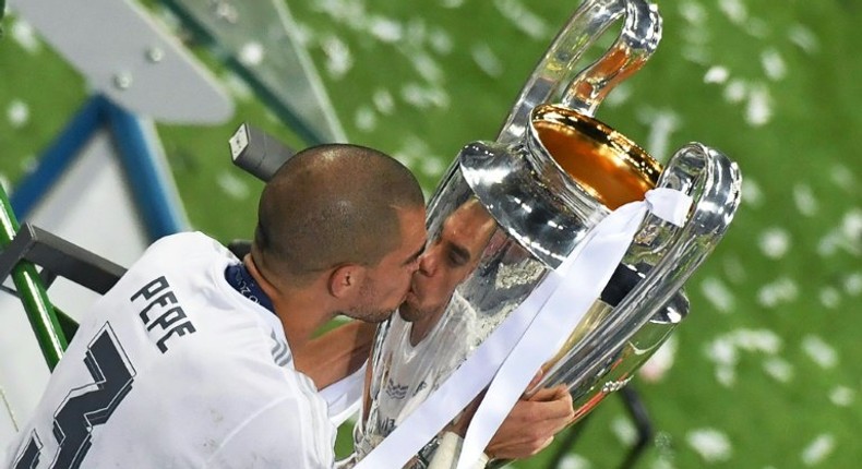 Real Madrid's Pepe lifts the Champions League trophy in Milan on May 28, 2016