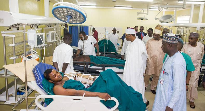 Buhari visits victims of bomb blasts, robbery, orders payment of medical bills