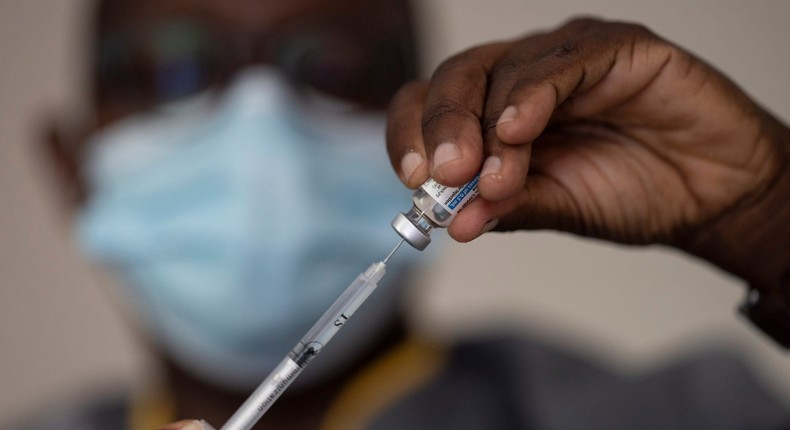 In this Wednesday, July 28, 2021 file photo, a health worker administers a dose of Janssen COVID-19 vaccine by Johnson & Johnson in the Medina neighborhood in Dakar, Senegal.
