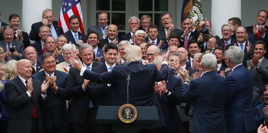 President Donald Trump congratulates House Republicans after they passed legislation aimed at repealing and replacing ObamaCare, during an event in the Rose Garden at the White House.