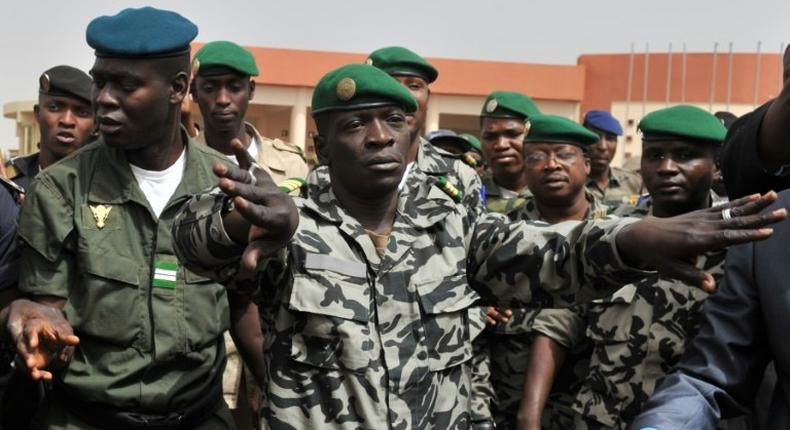 Malian military junta leader Amadou Sanogo (centre) who led the 2012 coup against then president Amadou Toumani Toure stood trial for murder and collusion over the massacre of soldiers who opposed the takeover