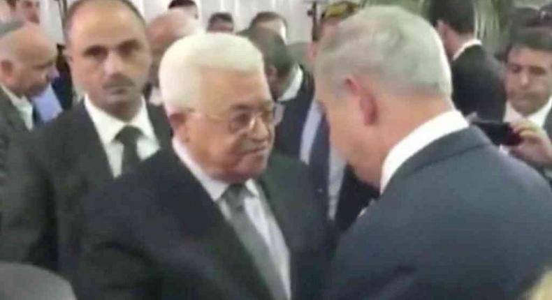 Palestinian president, Netanyahu shake hands at Peres funeral