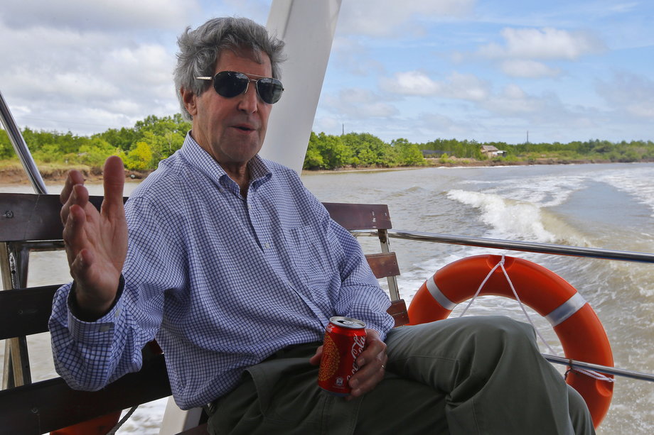 VIETNAM: Kerry rides a boat through the Mekong River Delta December 15, 2013. It was the first time Kerry has returned to the Mekong River Delta since he commanded a swift patrol boat during the Vietnam War.