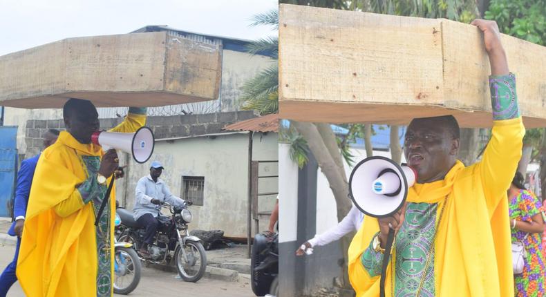 Archbishop Samson Benjamin embarks on a one-man protest with a coffin on his head