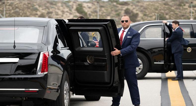 Members of the Secret Service open the doors to the presidential limousine in February 2024.SAUL LOEB/AFP via Getty Images