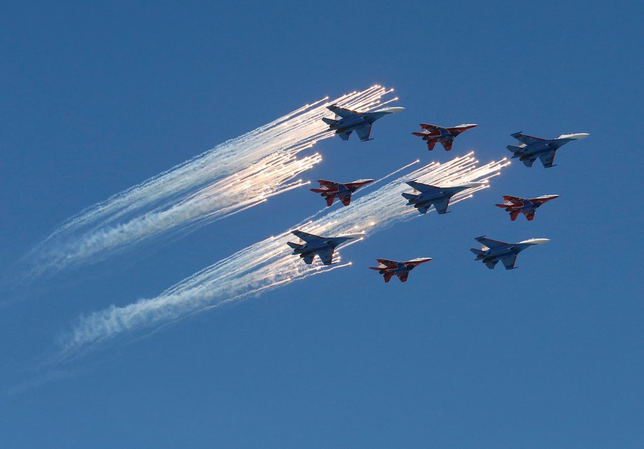 MiG-29 jet fighters of the Strizhi (Swifts) and Su-27 jet fighters of the Russkiye Vityazi (Russian Knights) aerobatic teams fly in formation during the Victory Day parade, marking the 71st anniversary of the victory over Nazi Germany in World War Two, above Red Square in Moscow, Russia, May 9, 2016.