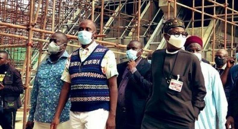 Minister of Transpiration, Rotimi Amaechi and Minister of Infirmation and Culture, Alhaji Lai Mohammed inspecting the rail project in the country. (PMNews)