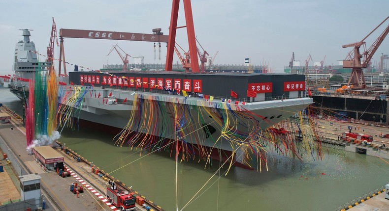 Celebrations at the launch ceremony for China's third aircraft carrier, the Fujian, at a dry dock in Shanghai on June 17, 2022.